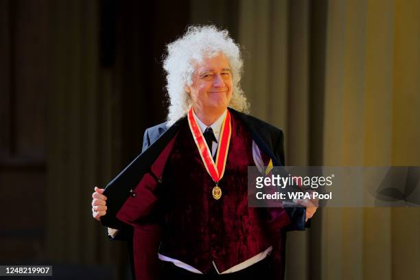 Sir Brian May after being made a Knight Bachelor for services to music and charity by King Charles III during an investiture ceremony at Buckingham...