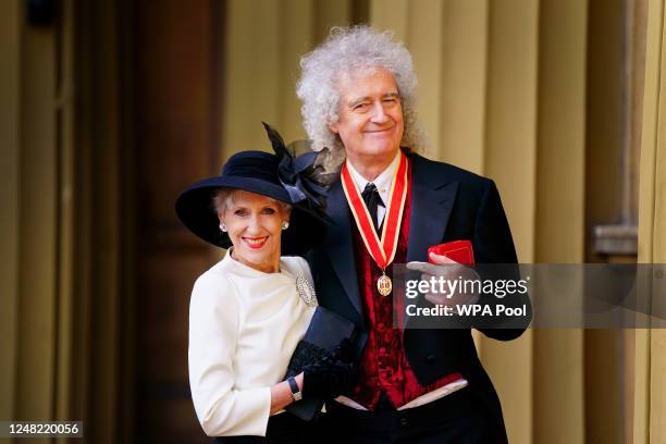 Sir Brian May with his wife Anita Dobson after being made a Knight Bachelor for services to music and charity by King Charles III during an...