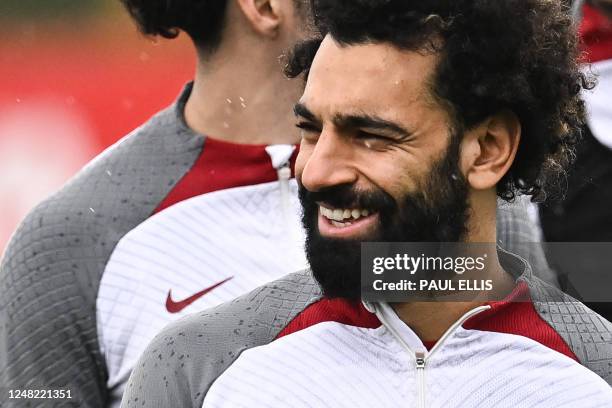 Liverpool's Egyptian striker Mohamed Salah takes part in a training session at Liverpool training ground in Liverpool, northwest England, on March 14...