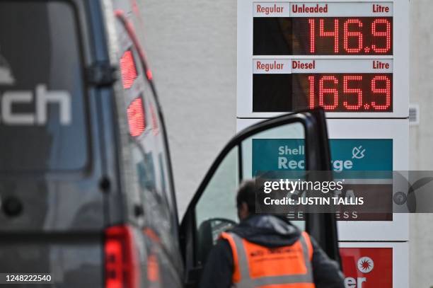 Photograph taken on March 14, 2023 shows the prices of fuel and diesel at a petrol station of the multinational oil and gas company Shell, in London.