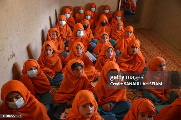 Girls attend a class at a local school in Zabul on March 14, 2023.