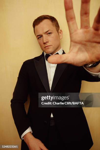 Actor Taron Egerton is photographed backstage at the 2023 EE BAFTA Film Awards, held at The Royal Festival Hall on February 19, 2023 in London,...