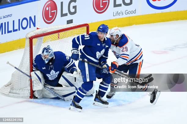 Edmonton Oilers center Leon Draisaitl battles in front of goal with Toronto Maple Leafs center John Tavares in the second period during the NHL...