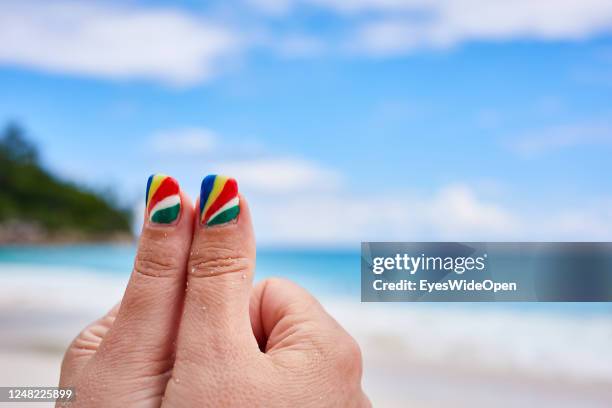 Finger nail art and design with the colours of the national flag on May 4, 2017 in Praslin, Seychelles.