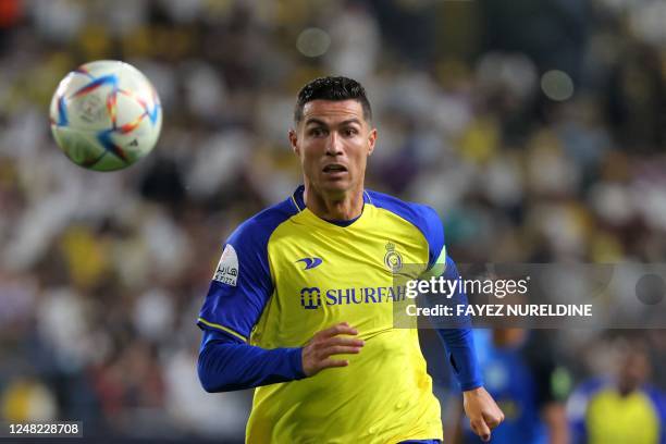 Nassr's Portuguese forward Cristiano Ronaldo looks on as he runs after ball during the King Cup quarter-final football match between al-Nassr and...