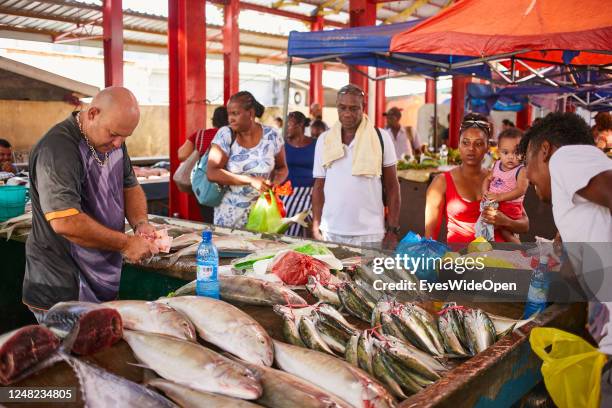 Man selling fresh fish at the local market on May 05, 2017 in Port Victoria, Seychelles.