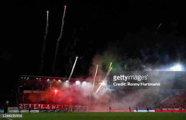 Supporters of Zwickau handle set off pyrotechnics during the 3. Liga match between FSV Zwickau and Erzgebirge Aue at GGZ Arena on March 14, 2023 in...