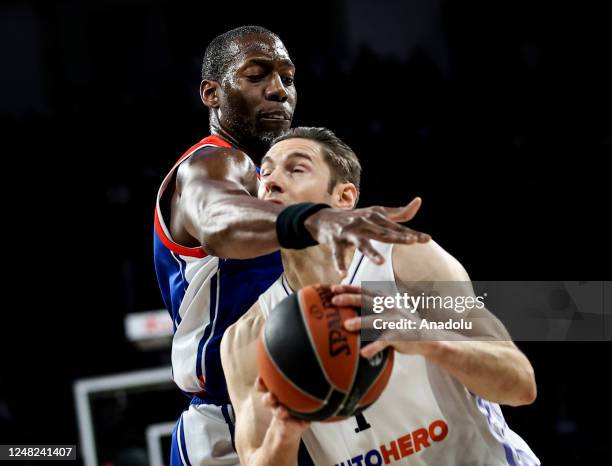 Bryant Dunston of Anadolu Efes in action against Fabien Causeur of Real Madrid during Turkish Airlines EuroLeague basketball match between Anadolu...