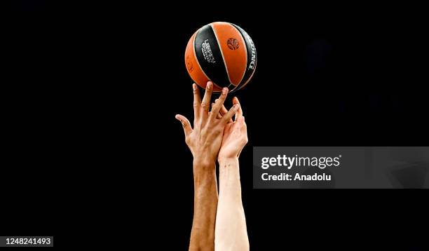 Players rise for the ball during the Turkish Airlines EuroLeague basketball match between Anadolu Efes and Real Madrid at Sinan Erdem Sports Hall in...