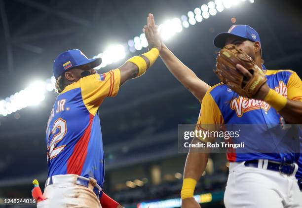 Ronald Acuña Jr. #42 of Team Venezuela celebrates with teammates as he walks off the field during Game 7 of Pool D between Team Nicaragua and Team...