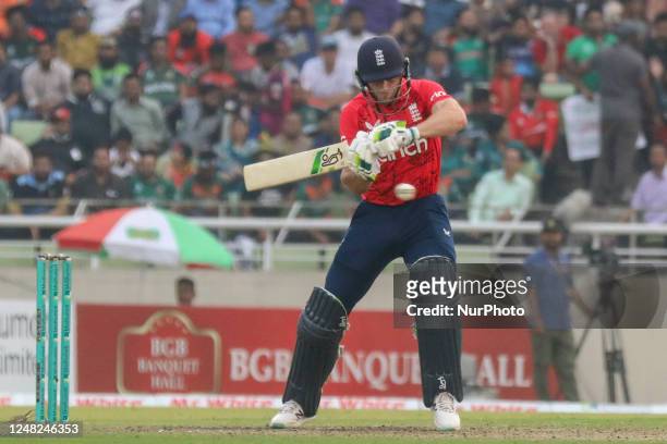 England's captain Jos Buttler plays a shot during the third and final Twenty20 international cricket match between Bangladesh and England at the...