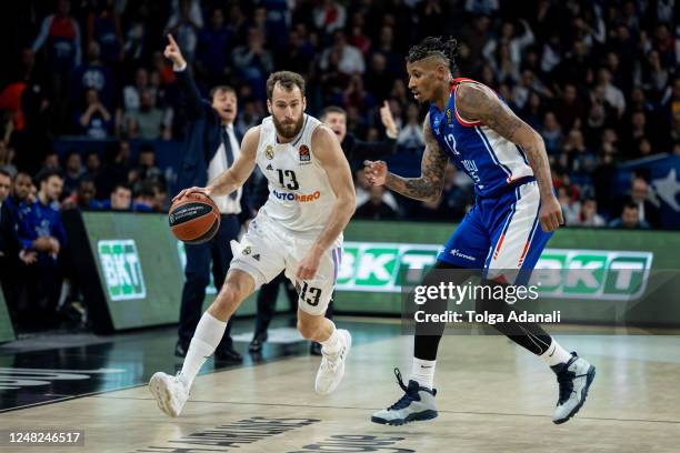 Sergio Rodriguez, #13 of Real Madrid in action with Will Clyburn, #12 of Anadolu Efes Istanbul during the 2022-23 Turkish Airlines EuroLeague Regular...