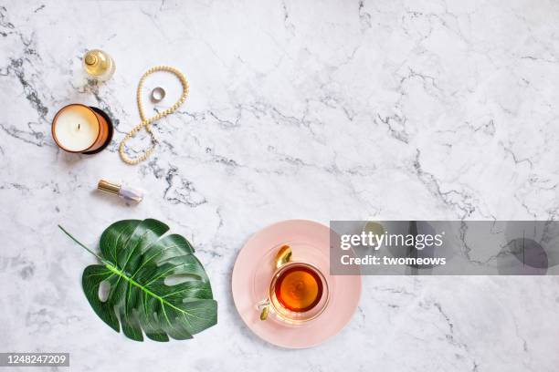 stylised feminine flat lay table top still life. - cup of tea from above fotografías e imágenes de stock