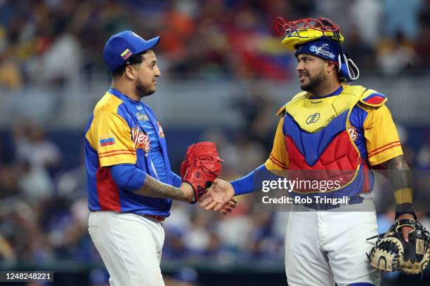 José Quijada and Omar Narváez of Team Venezuela celebrate the final out of the eighth inning of Game 7 of Pool D between Team Nicaragua and Team...