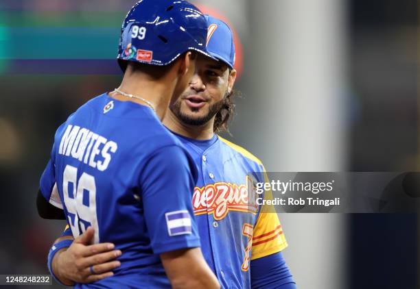 Juan Montes of Team Nicaragua and Eugenio Suárez of Team Venezuela talk on field during the seventh inning of Game 7 of Pool D between Team Nicaragua...