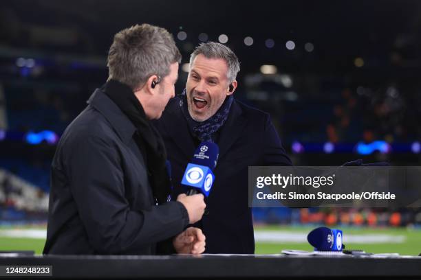 Sports pundit Jamie Carragher laughs in the face of Noel Gallagher during the UEFA Champions League round of 16 leg two match between Manchester City...