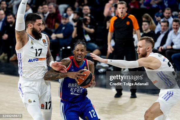 Will Clyburn, #12 of Anadolu Efes Istanbul in action with Vincent Poirier, #17 and Dzanan Musa, #31 of Real Madrid during the 2022-23 Turkish...