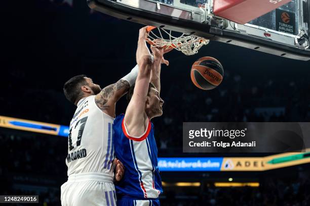 Tibor Pleiss, #21 of Anadolu Efes Istanbul in action with Vincent Poirier, #17 of Real Madrid during the 2022-23 Turkish Airlines EuroLeague Regular...
