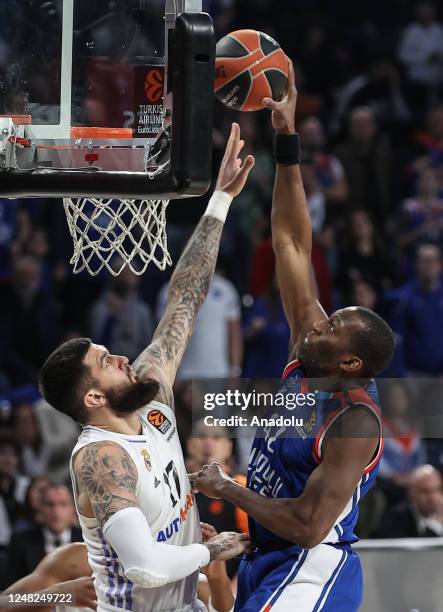 Bryant Dunston of Anadolu Efes in action against Vincent Yann Poirier during Turkish Airlines EuroLeague basketball match between Anadolu Efes and...