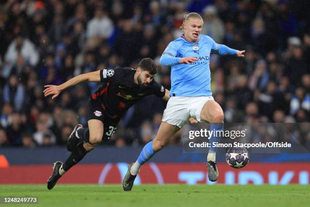 Erling Haaland of Manchester City runs from Josko Gvardiol of RB Leipzig during the UEFA Champions League round of 16 leg two match between...