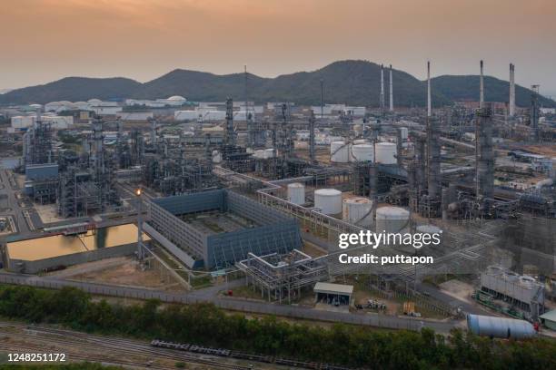 panorama of the landscape of the oil refinery with tube and oil tank along twilight sky at beautiful, refinary plant with oil tank storage, petrochemical plant - iran saudi stock pictures, royalty-free photos & images