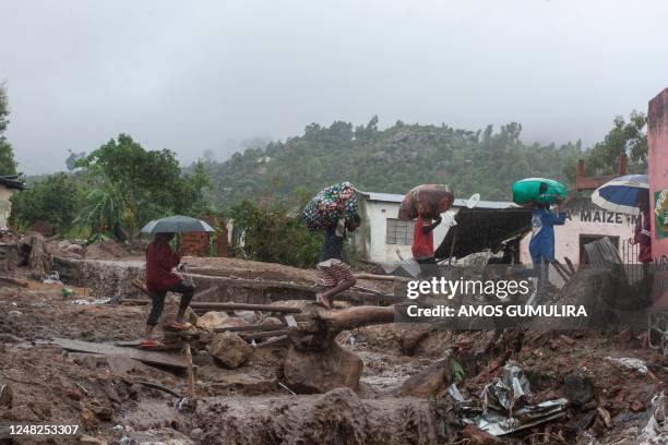 People repatriate residents and their property from a flood affected Chimwankhunda location in Blantyre on March 14, 2023 following heavy rains...