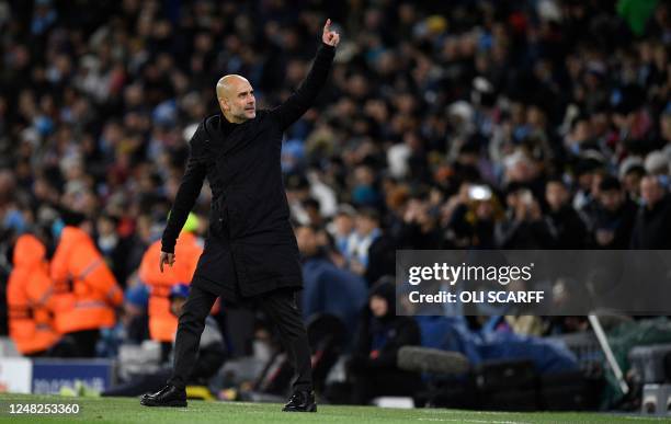 Manchester City's Spanish manager Pep Guardiola cheers the crowd after their fifth goal during the UEFA Champions League round of 16 second-leg...