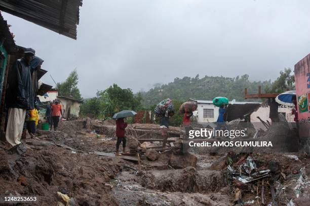 People repatriate residents and their property from a flood affected Chimwankhunda location in Blantyre on March 14, 2023 following heavy rains...