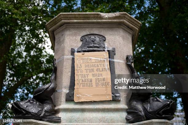 Close-up of the Edward Colston statue plinth on June 8, 2020 in Bristol, England. Yesterday, protesters in Bristol toppled the statue of Edward...