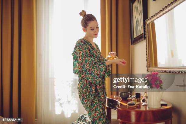 young woman at home - dressing table stock pictures, royalty-free photos & images