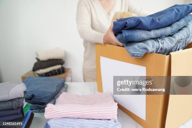 Clothes Packing In Store Garment Storage Photos and Premium High Res Pictures - Getty Images