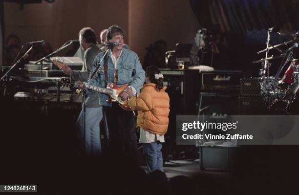 English musician Paul McCartney performs in the Earth Day Concert at the Hollywood Bowl in Los Angeles, California, as part of his New World Tour,...