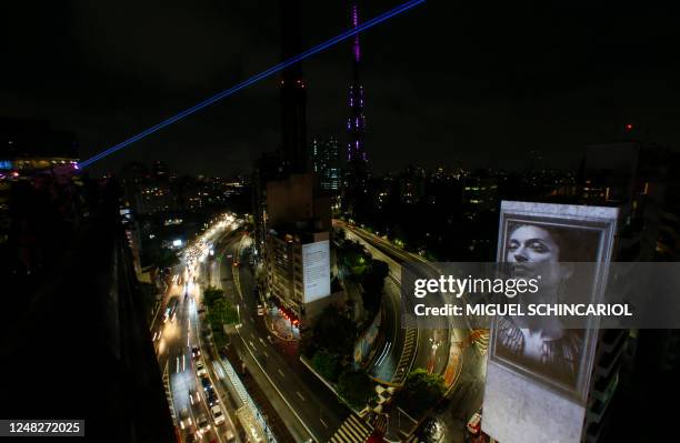 An image of slain Brazilian rights activist and politician Marielle Franco is projected on the side of the Anchieta Building on the fifth anniversary...