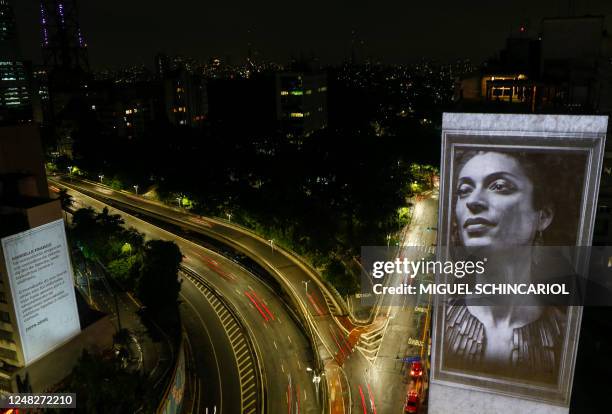 An image of slain Brazilian rights activist and politician Marielle Franco is projected on the side of the Anchieta Building on the fifth anniversary...