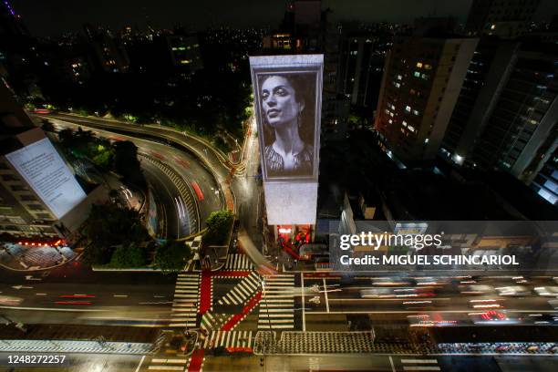 An image of slain Brazilian rights activist and politician Marielle Franco is projected on the side of the Anchieta Building on the fifth anniversary...