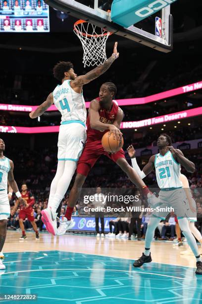 Caris LeVert of the Cleveland Cavaliers passes the ball during the game during the game against the Charlotte Hornets on March 14, 2023 at Spectrum...