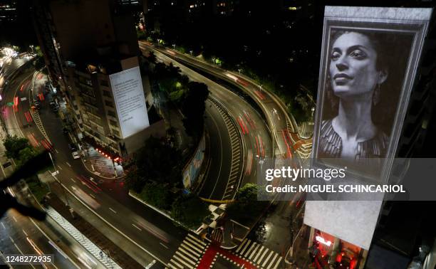 An image of slain Brazilian rights activist and politician Marielle Franco is projected on the side of the Anchieta Building on the fifth anniversary...