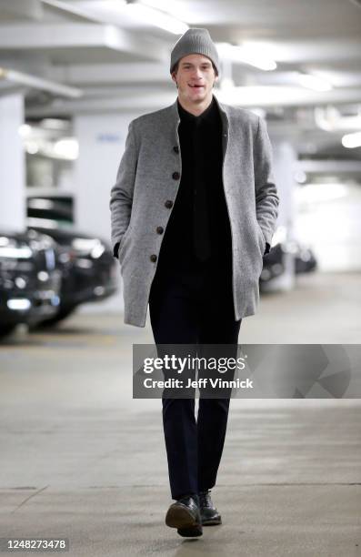 Jack Studnicka of the Vancouver Canucks walks to the Canucks dressing room before their NHL game against the Dallas Stars at Rogers Arena March 14,...