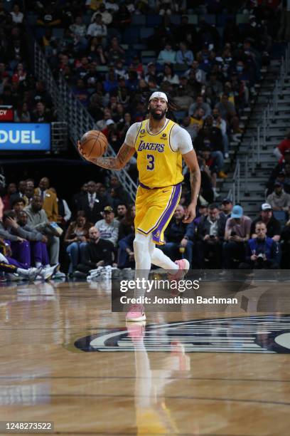 Anthony Davis of the Los Angeles Lakers handles the ball during the game against the New Orleans Pelicans on March 14, 2023 at the Smoothie King...