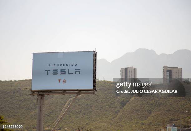 Billboard welcoming the American electric car maker Tesla is seen in Monterrey, state of Nuevo Leon, Mexico, on March 12, 2023. - Monterrey has...