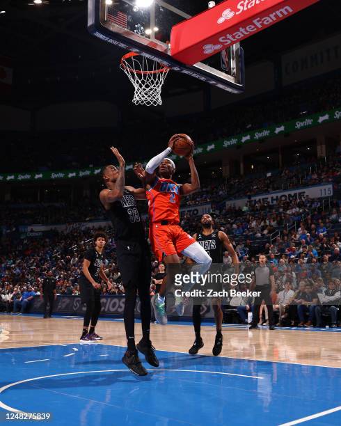 Shai Gilgeous-Alexander of the Oklahoma City Thunder drives to the basket during the game against the Brooklyn Nets on March 14, 2023 at Paycom Arena...