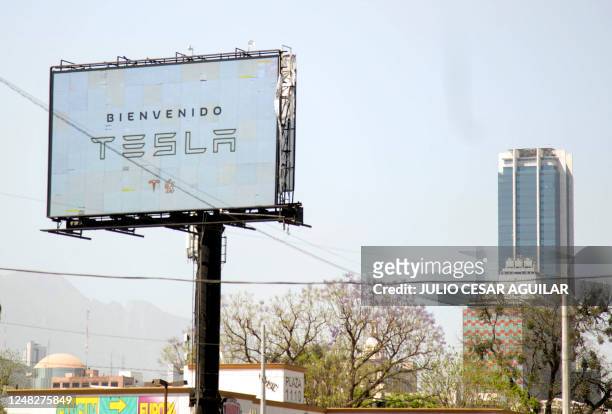 Billboard welcoming the American electric car maker Tesla is seen in Monterrey, state of Nuevo Leon, Mexico, on March 12, 2023. - Monterrey has...