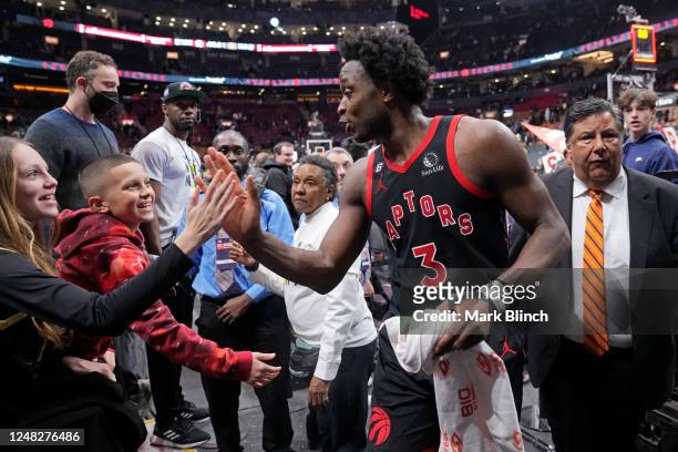 Anunoby of the Toronto Raptors shake hands with fans after the game against the Denver Nuggets on march 14, 2023 at the Scotiabank Arena in Toronto,...