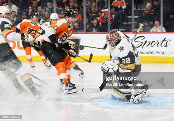 Jonathan Quick of the Vegas Golden Knights stops a third period shot on goal by Scott Laughton of the Philadelphia Flyers at the Wells Fargo Center...