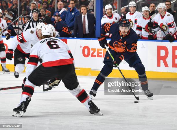 Leon Draisaitl of the Edmonton Oilers skates against Jakob Chychrun of the Ottawa Senators during the game on March 14, 2023 at Rogers Place in...