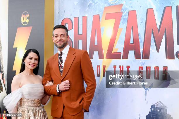 Lucy Liu and Zachary Levi at the premiere of "Shazam! Fury of the Gods" held at Regency Village Theatre on March 14, 2023 in Los Angeles, California.