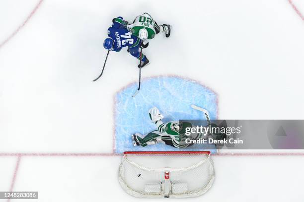 Phillip Di Giuseppe of the Vancouver Canucks scores a goal on Matt Murray of the Dallas Stars during the first period of their NHL game at Rogers...