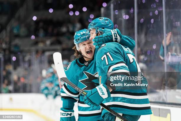 Nikolai Knyzhov and Alexander Barabanov of the San Jose Sharks celebrate scoring a goal against the Columbus Blue Jackets at SAP Center on March 14,...