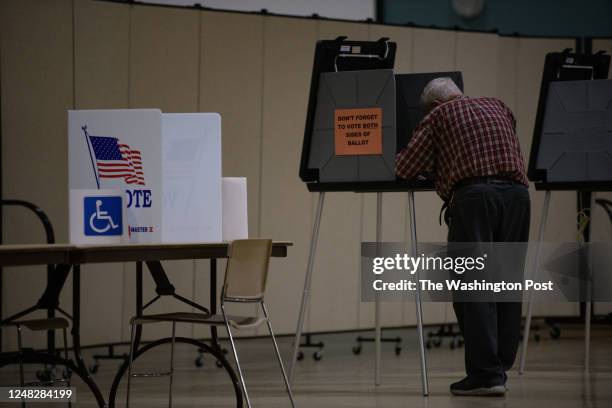 United States A man fills out a voting ballot at Snyder Memorial Baptist church in Fayetteville, NC on November 8, 2022 during Election Day for the...