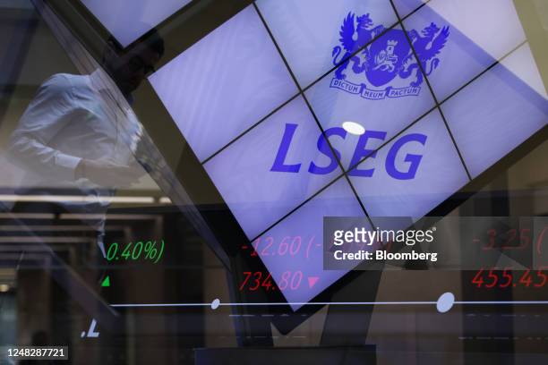 Multiple exposures were combined in camera to produce this image. Stock price information displayed in the London Stock Exchange Group Plc's office...